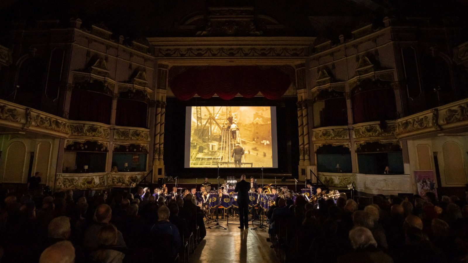 A screening of film in a cinema with a live score
