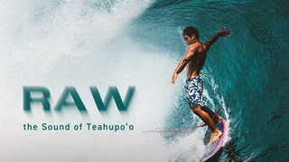 Film poster, the word RAW superimposed over a surfer riding his board, a large wave curling round him