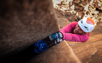 Climber jamming hands in a wide crack