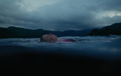 Nikki laying in the lake of the Lake District in the UK