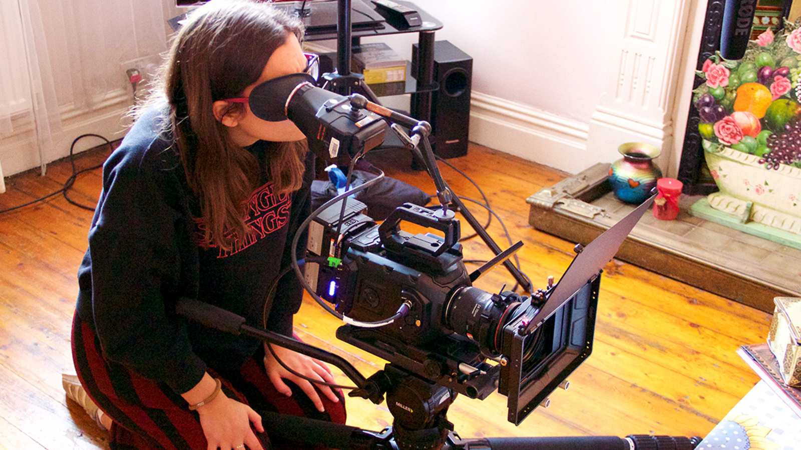A filmmaker composes a shot as part of HOME's BFI Film Academy Short Course