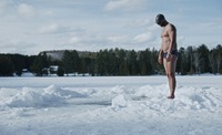 Freediver Arthure G.B. concentrates before having to dive into the frozen lake without a wet suit.