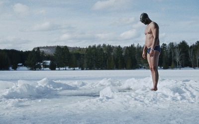 Freediver Arthure G.B. concentrates before having to dive into the frozen lake without a wet suit.