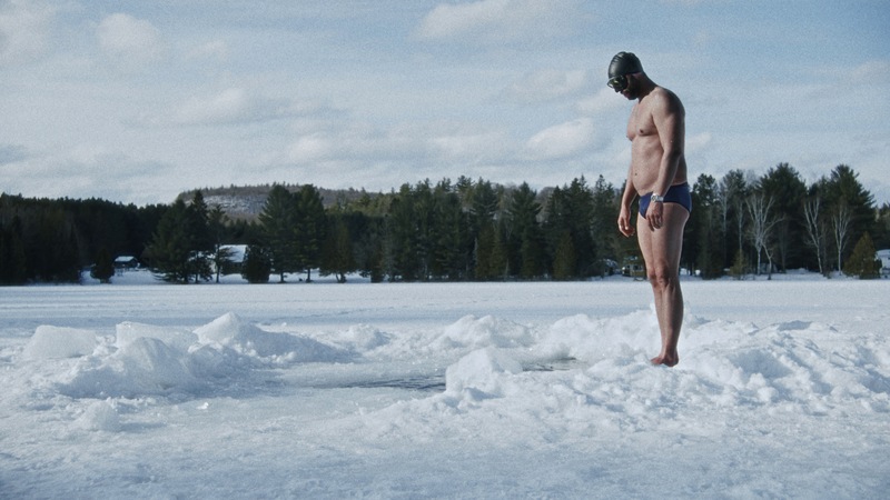 Freediver Arthure G.B. concentrates before having to dive into the frozen lake without a wet suit.