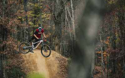 Craig Evans mid air on a bicycle