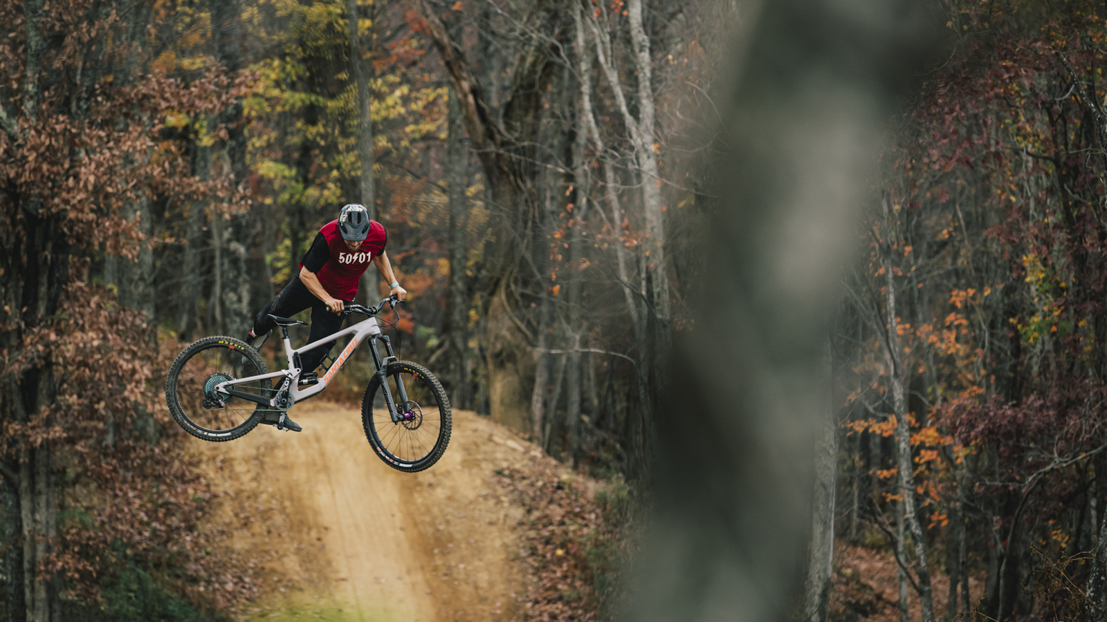 Craig Evans mid air on a bicycle