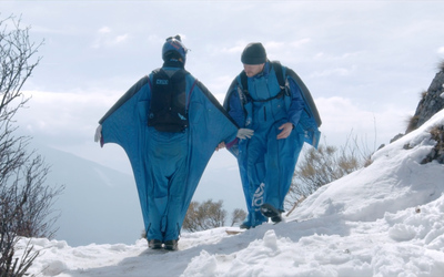 Wingsuit couple standing at an exit Point