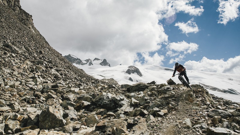 Sam Dale riding down a glacier