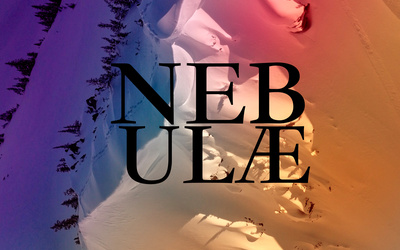 A mountain ridge covered in snow in various bright colours.