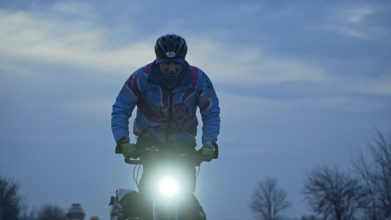 Luke rides his tandem bike through the cold dark night in Ukraine