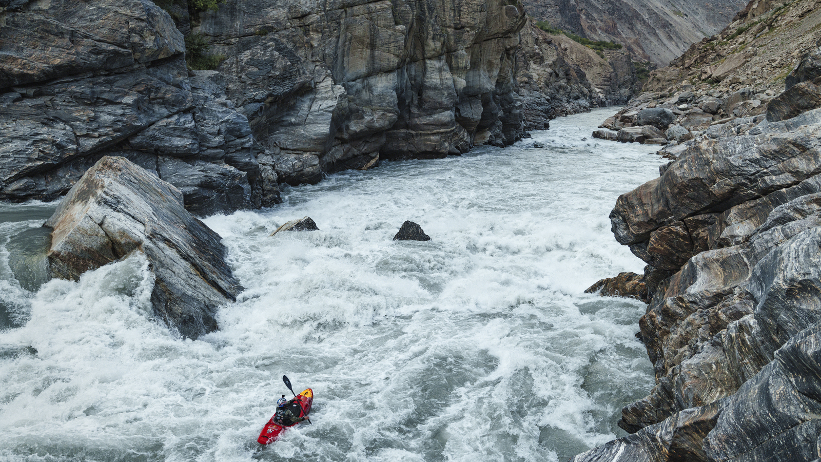 Kayaker Nouria Newman drops in a huge rapid on the Indus
