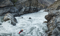 Kayaker Nouria Newman drops in a huge rapid on the Indus