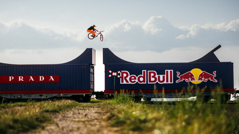 Dawid Godziek preforms frontflip over train gap jump in Biała.