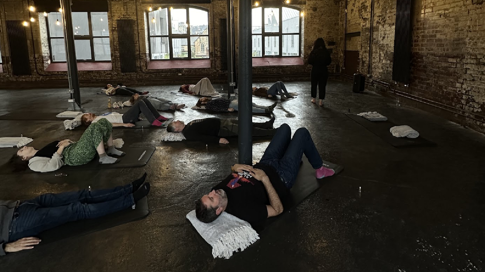 Image of people taking part in a breathwork practice 