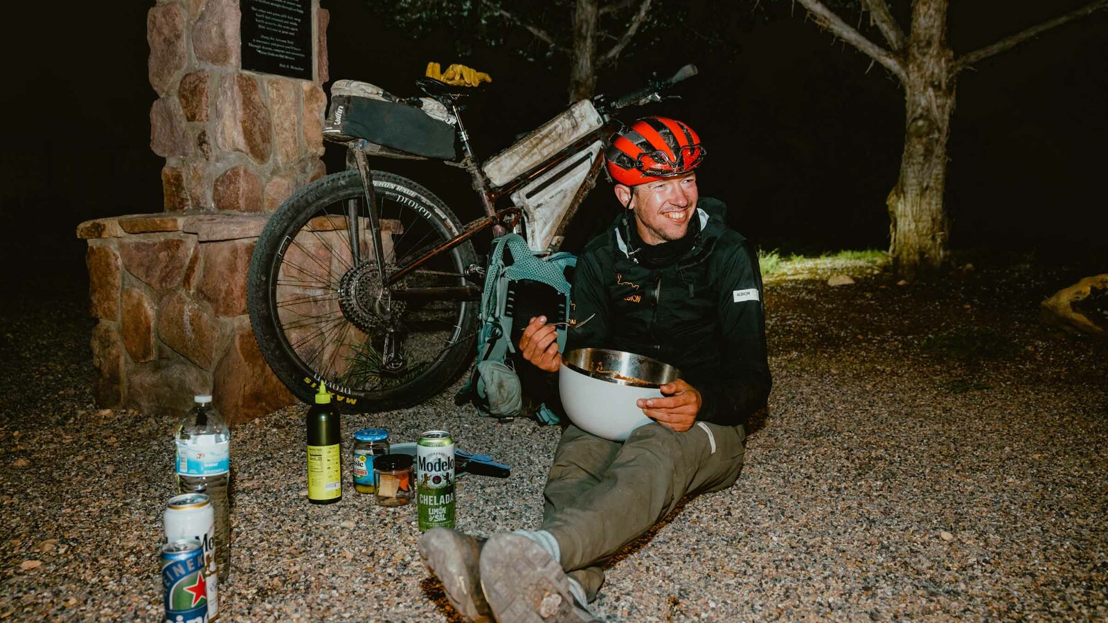 Justinas eating a big bowl of pasta to celebrate finishing the end of the Arizona Trail Bike Race. 