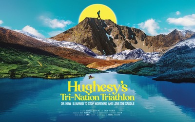 The poster for the film, showing a vast a landscape of a lake, fields and mountains in the background, with Adventurer Claire Hughes striding across the mountain ridge.