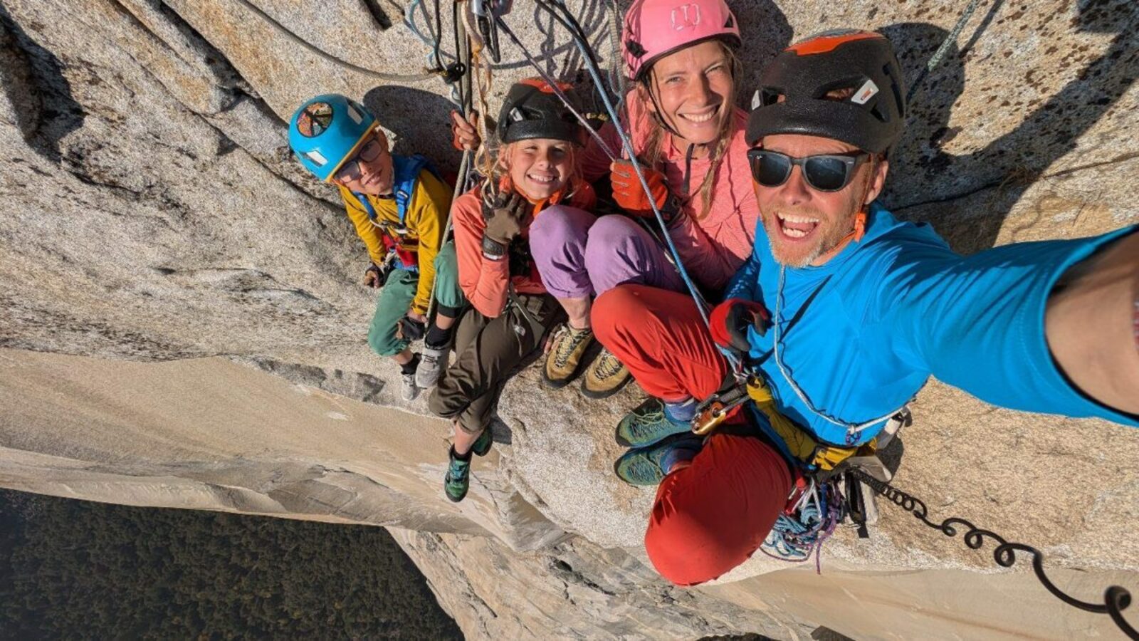 Climber Leo Houlding and his family take a selfie as they sit on a ting ledge on the sheer rock face of El Capitan.