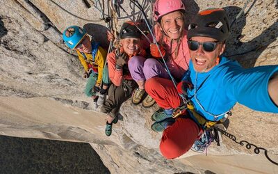 Climber Leo Houlding and his family take a selfie as they sit on a ting ledge on the sheer rock face of El Capitan.
