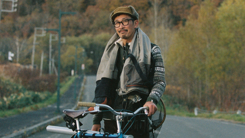 Goro Obata with his bike and fishing rod in Hokkaido, Japan