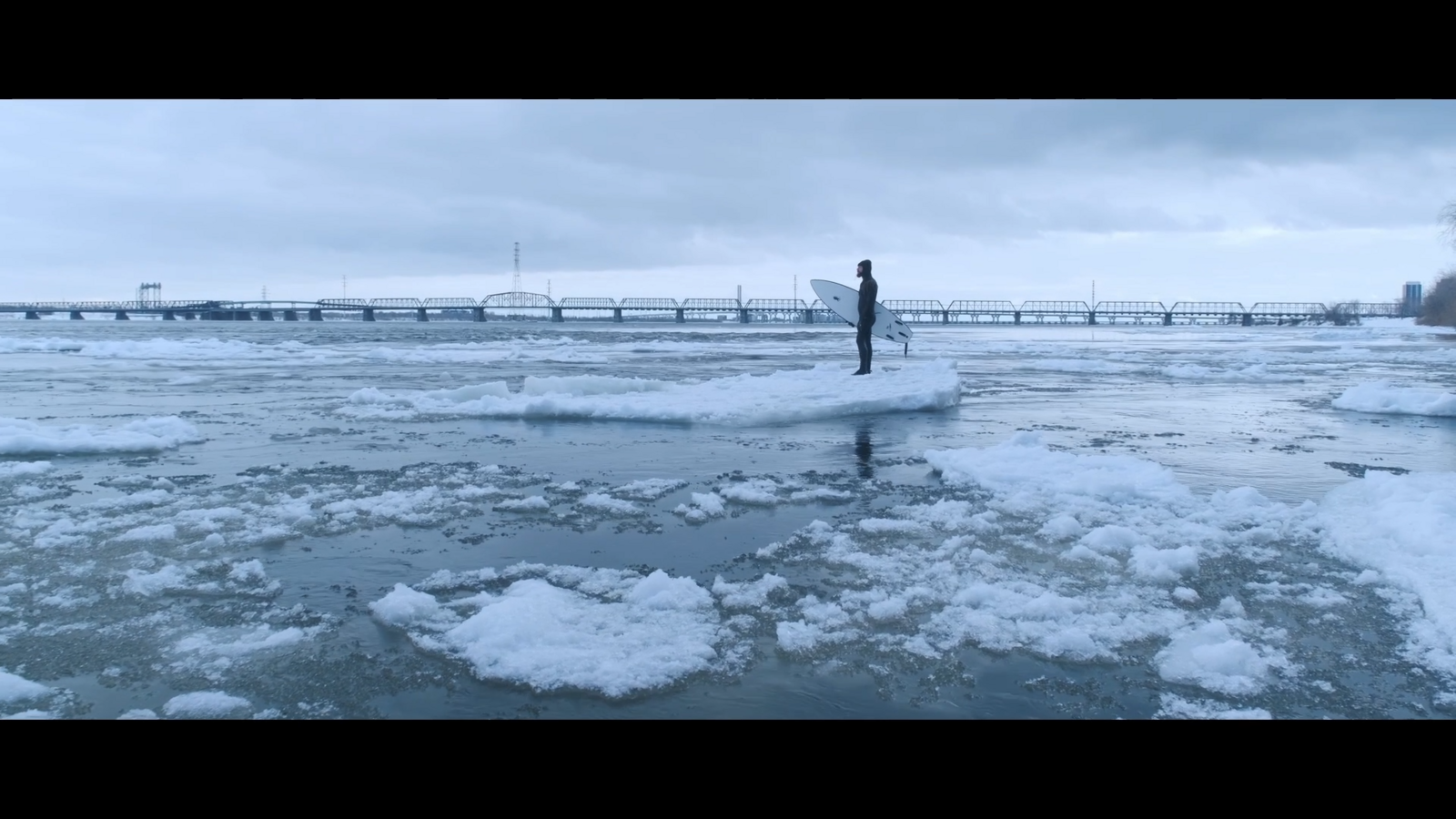 Orion navigating the ice field before surfing in the river.