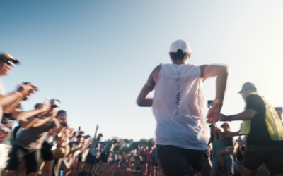 Ultrarunner Kilian Jornet races down the final 400 meters of Western States 100 Miler on a track surrounding by cheering spectators