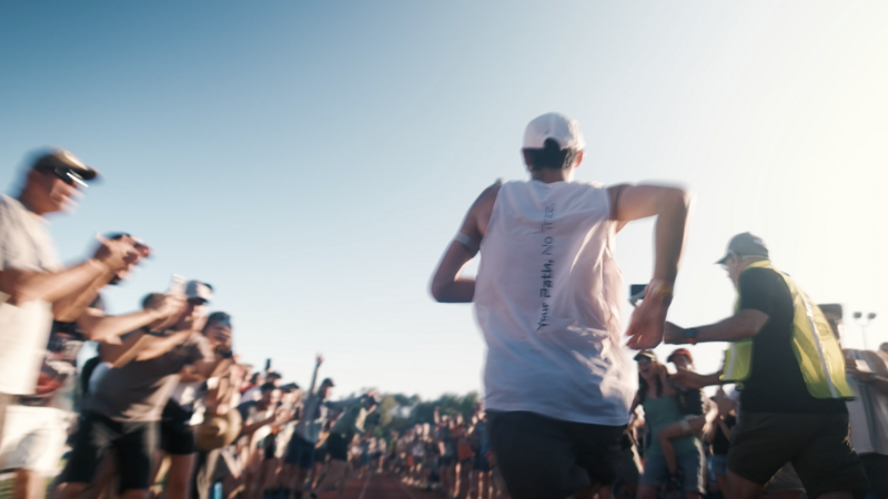 Ultrarunner Kilian Jornet races down the final 400 meters of Western States 100 Miler on a track surrounding by cheering spectators