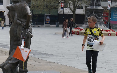 a young boy orienteering in sheffield city centre